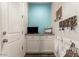 Laundry room with white cabinets and light blue walls at 19544 W Lincoln St, Buckeye, AZ 85326