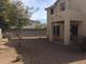 Small backyard with gravel landscaping and covered patio at 2636 S Sailors Way, Gilbert, AZ 85295