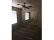 Bright bedroom with mirrored closet doors and ceiling fan at 2636 S Sailors Way, Gilbert, AZ 85295