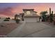 Two-story home with a landscaped front yard and a two-car garage at 2871 S Los Altos Pl, Chandler, AZ 85286