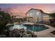 Inviting kidney-shaped pool with a large backyard and patio at 2871 S Los Altos Pl, Chandler, AZ 85286