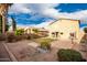 Large backyard with grassy area and patio at 30052 N Desert Willow Blvd, San Tan Valley, AZ 85143