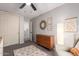 Bedroom with dresser, armchair, and ceiling fan at 30052 N Desert Willow Blvd, San Tan Valley, AZ 85143