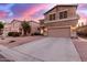 Two story home with attached two car garage and desert landscaping at 30052 N Desert Willow Blvd, San Tan Valley, AZ 85143