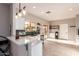 Modern kitchen with white cabinets, dark tile backsplash, and stainless steel appliances at 30052 N Desert Willow Blvd, San Tan Valley, AZ 85143