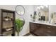 Modern bathroom with dark vanity, marble countertop, and stylish decor at 3655 N 5Th Ave # 115, Phoenix, AZ 85013