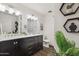 Elegant bathroom with double vanity, marble countertop, and modern lighting at 3655 N 5Th Ave # 115, Phoenix, AZ 85013