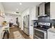 Modern kitchen with stainless steel appliances and dark hexagon backsplash at 3655 N 5Th Ave # 115, Phoenix, AZ 85013