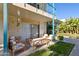 Relaxing patio with wooden furniture and lush greenery at 3655 N 5Th Ave # 115, Phoenix, AZ 85013