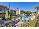 Inviting community pool with surrounding lounge chairs and patio furniture at 3655 N 5Th Ave # 115, Phoenix, AZ 85013