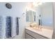 Clean bathroom with a vanity and a large mirror at 392 E Laddoos Ave, Queen Creek, AZ 85140