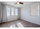 Bright bedroom with neutral walls and carpet flooring at 392 E Laddoos Ave, Queen Creek, AZ 85140