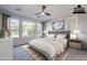 Virtually staged main bedroom with plush carpet and large windows at 392 E Laddoos Ave, Queen Creek, AZ 85140