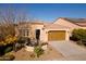 Single-story home with a two-car garage and desert landscaping at 392 E Laddoos Ave, Queen Creek, AZ 85140