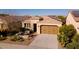 Single-story home with desert landscaping, and a two-car garage at 392 E Laddoos Ave, Queen Creek, AZ 85140