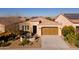 Single-story home with a two-car garage and solar panels at 392 E Laddoos Ave, Queen Creek, AZ 85140