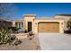 Single story home with a two-car garage and landscaped front yard at 392 E Laddoos Ave, Queen Creek, AZ 85140