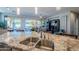 Granite kitchen island with double sink and breakfast bar seating at 392 E Laddoos Ave, Queen Creek, AZ 85140