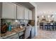 Built-in kitchen nook with granite countertop, perfect for a home office at 392 E Laddoos Ave, Queen Creek, AZ 85140