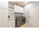 Laundry room with washer, dryer, and cabinets at 392 E Laddoos Ave, Queen Creek, AZ 85140