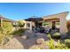 Relaxing patio with seating, fire pit, and umbrella at 392 E Laddoos Ave, Queen Creek, AZ 85140