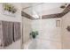 Walk-in shower with tiled walls and built-in seat at 392 E Laddoos Ave, Queen Creek, AZ 85140