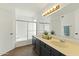 Bathroom featuring dual sinks, and a shower-tub combo with sliding glass doors at 4306 E Frye Rd, Phoenix, AZ 85048