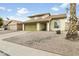 Inviting home with desert landscaping, a tile roof, and an attached two-car garage at 4306 E Frye Rd, Phoenix, AZ 85048