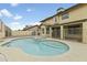 Backyard swimming pool with spa surrounded by a white iron fence at 4306 E Frye Rd, Phoenix, AZ 85048