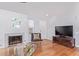 Living room features a fireplace and hardwood floors at 5210 W Jupiter N Way, Chandler, AZ 85226