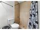 Bathroom featuring a shower and neutral-toned tile at 5546 W Encanto Blvd, Phoenix, AZ 85035