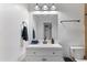 Clean bathroom with white vanity and a large mirror at 5546 W Encanto Blvd, Phoenix, AZ 85035