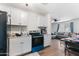 Updated kitchen featuring white cabinets and a black refrigerator at 5546 W Encanto Blvd, Phoenix, AZ 85035