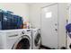 Laundry room with washer, dryer, and extra storage at 5546 W Encanto Blvd, Phoenix, AZ 85035