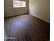 Bedroom with wood-look flooring and natural light at 5839 E Norwood St, Mesa, AZ 85215