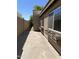 The exterior showcases flower boxes beneath the windows, complemented by a walkway to the backyard at 5839 E Norwood St, Mesa, AZ 85215