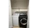 Laundry closet with a washer and dryer, and shelving at 5839 E Norwood St, Mesa, AZ 85215
