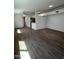 An open-concept living room with hardwood floors provides plenty of space to entertain at 5839 E Norwood St, Mesa, AZ 85215