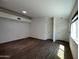 Open living room with wood-look flooring, recessed lighting and neutral paint at 5839 E Norwood St, Mesa, AZ 85215