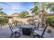 Relaxing backyard patio with fire pit and seating area, perfect for outdoor entertaining at 72 E Camellia Way, Queen Creek, AZ 85140