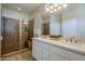 Bathroom with a walk-in shower and double vanity at 72 E Camellia Way, Queen Creek, AZ 85140