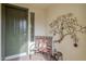 Welcoming entryway with decorative bench and wall art at 72 E Camellia Way, Queen Creek, AZ 85140