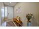 Bright and airy entryway with wooden bench and decor at 72 E Camellia Way, Queen Creek, AZ 85140