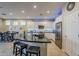 Spacious kitchen featuring an island, stainless steel appliances, and white cabinetry at 72 E Camellia Way, Queen Creek, AZ 85140