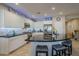 Modern kitchen with island, stainless steel appliances, and white cabinets at 72 E Camellia Way, Queen Creek, AZ 85140