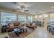 Spacious living area featuring leather sofas and large windows at 72 E Camellia Way, Queen Creek, AZ 85140