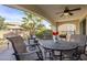 Covered patio with outdoor seating and a fire pit at 72 E Camellia Way, Queen Creek, AZ 85140