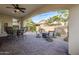 Relaxing patio with seating area and fire pit at 72 E Camellia Way, Queen Creek, AZ 85140