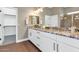 Modern bathroom with granite countertop and double vanity at 7873 W Fetlock Trl, Peoria, AZ 85383