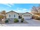 Single-story home with two-car garage and desert landscaping at 7873 W Fetlock Trl, Peoria, AZ 85383